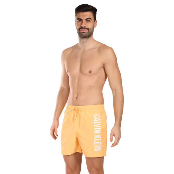 Pánske plavky Calvin Klein oranžové (KM0KM01004-SAN)